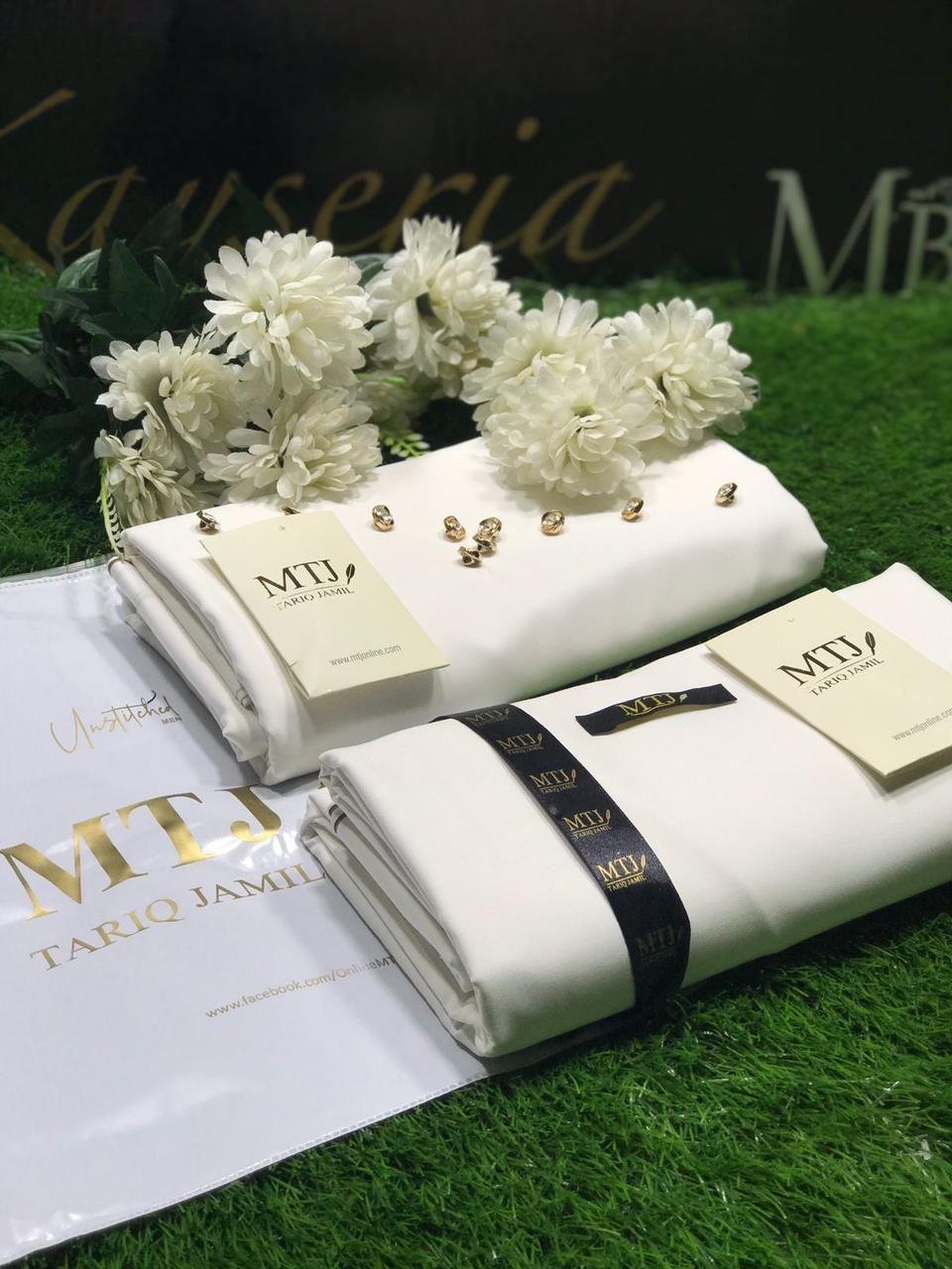 Premium Men's White Boski Suit. Unstitched 4-meter fabric with 8 buttons and brand tag included. Perfect for all seasons and formal occasions.